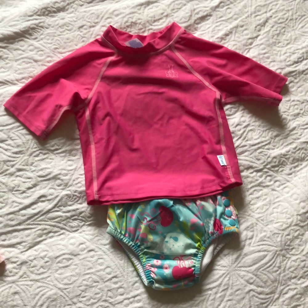 Two piece rash guard. Bottoms are swim diaper.
